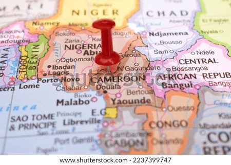 Red Push Pin Pointing on Cameroon World Map Close-Up View Stock Photograph