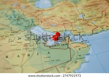 Red pushpin marking the Persian Gulf on world map