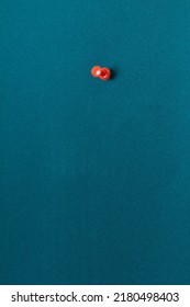 Red Pushpin On A Green Board 