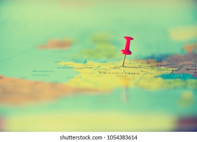 Red pushpin, thumbtack, pin showing the location, travel destination point on map. Copy space, lifestyle concept.