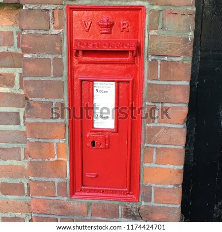 Red Queen Victoria post box, the iconic British public company responsible for providing post office services to the public through its nationwide network of post office branches