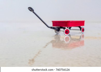 Red Radio Flyer Wagon And Reflection