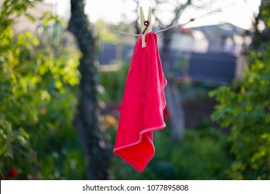 A Red Rag Is Dried On A Rope And Clothespin