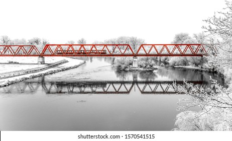 red railway bridge over Mures river in Arad, Romania
