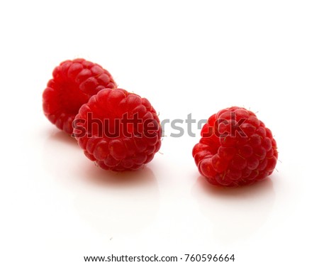 Red raspberries isolated on white background three whole
