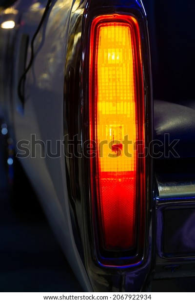 red\
rear light of the car. glowing car rear brake\
light