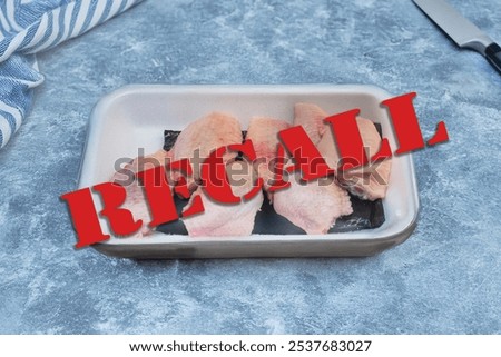 Red recall warning message over tray of raw chicken