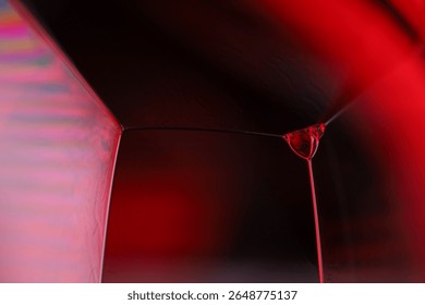 Red reflections of liquid in macro, red liquid surface, bubbles in macro, connection of bubbles in macro, cell from liquid, horror background, glossy surface panels