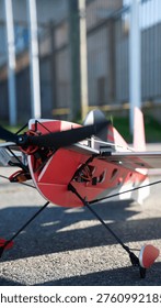 Red Remote Control Model Airplane on Ground, RC plane