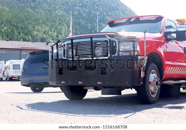 red rescue tow truck for vehicles, the\
topic of assistance on the road and in\
industry\
