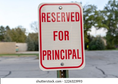 Red Reserved For Principal Sign In Parking Lot