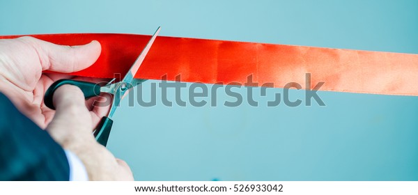 Red ribbon\
cutting