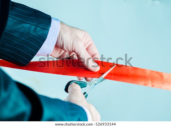 Red ribbon\
cutting