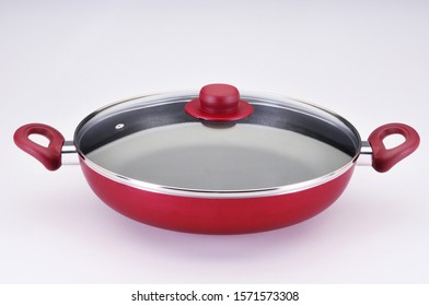 Red Rice Cooker With Glass Lid On White Background