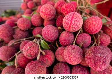 red ripe lychees stacks at traditional marketplace in Taiwan - Shutterstock ID 2109503339