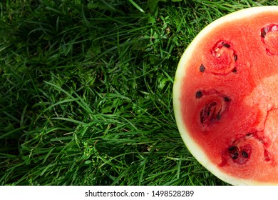 Red, Ripe Watermelon, Cut In Half, Lying On The Green Grass, Lawn. Place Under The Text, Holotype.