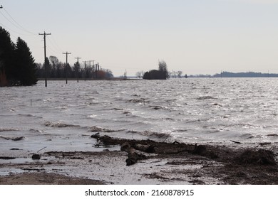 Red River Flood Waters Flooding Over Rural Road