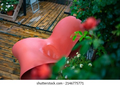 Red Rocking Chair In The Garden