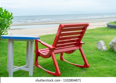 Red Rocking Chair For Sitting On The Beach