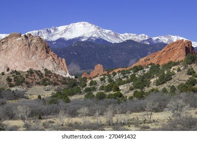 Red Rocks At Garden Of The Gods In Colorado Springs With Pikes Peak In Background.