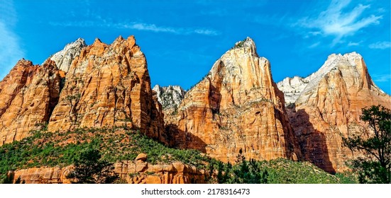 Red rocks in a mountain canyon. Mountain canyon rocks. Canyon rocks in mountains. Mountain canyon rocks panorama