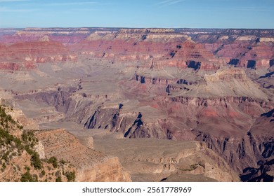 Red rocky cliff view at the Grand Canyon National Park South Rim in Arizona. Photo taken on a clear sky day - Powered by Shutterstock