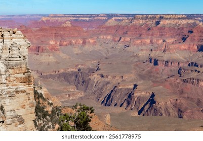 Red rocky cliff view at the Grand Canyon National Park South Rim in Arizona. Photo taken on a clear sky day - Powered by Shutterstock