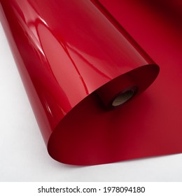 Red Roll Of Packaging Film (paper)  On A White Background