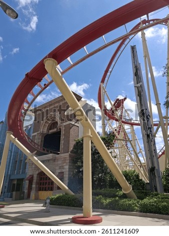 Red rollercoaster into a building in Universal Studios in Florida