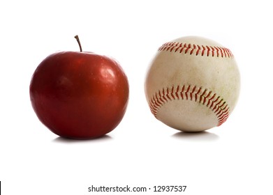 A Red Rome Apple And A Baseball On A White Background,  Symbols Of The American Summertime, With Copy Space