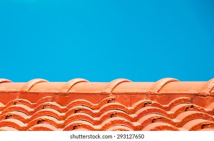 Red Roof Tile Pattern Over Blue Sky