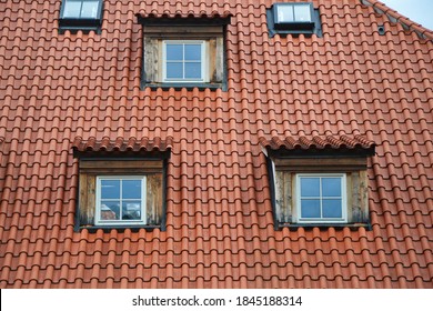 Red Roof Tiles And Small Windows