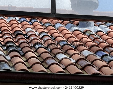 red roof tiles yellow building arches decor