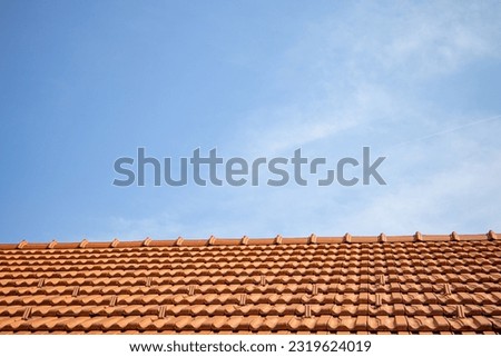Red roof top and blue sky