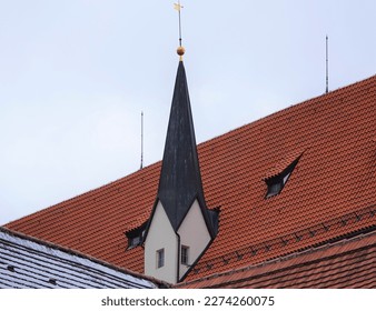Red Roof and unusual spire in the Bavarian town of Fussen Germany, Europe.