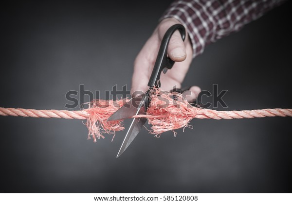 Red rope is
cut with scissors./Red rope is cut
up