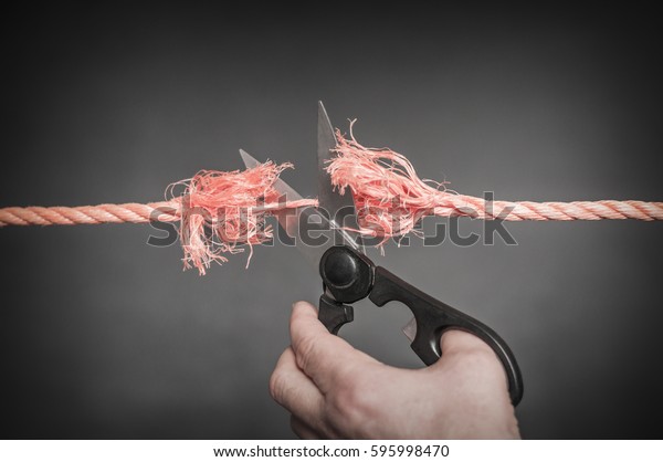 Red rope is
cut with scissors./Red rope is cut
up