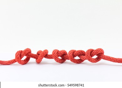 Red Rope in A Knot Isolated on White Background.