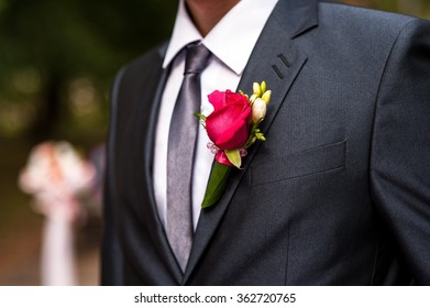 Red Rose Boutonniere In The Pocket Of The Groom