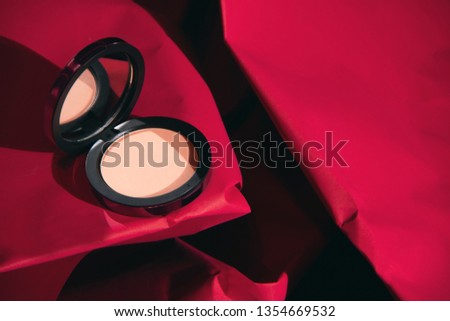 red rose color of beauty fashion makeup cosmetic face foundation with mirror product package mockup on paper texture