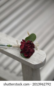 Red Rose Corsage In White Bench