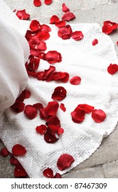 Red Rose Pedals On A White Wedding Dress