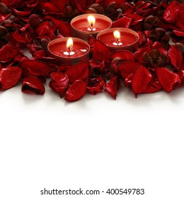 red roses and candles on whiter background with space for your text - Shutterstock ID 400549783