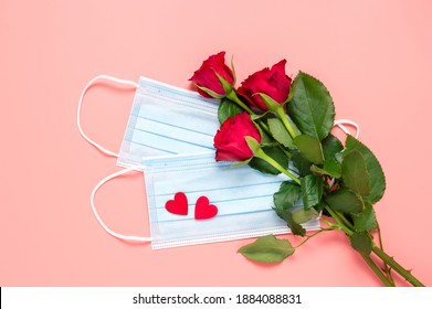 Red Roses And Disposable Face Masks With Two Hearts On Pink Background. Mothers, Womens Or Valentines Day Celebration During Coronavirus Pandemic. New Normal, Dating, Love And Covid-19 Concept