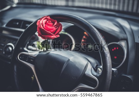 Red Roses flower in car for surprise love and Romantic symbol in Valentine's Day background . Customize colors Vintage retro and old film Tone with copy space