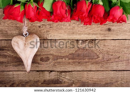 red roses and a heart on wooden board, Valentines Day background,  wedding day
