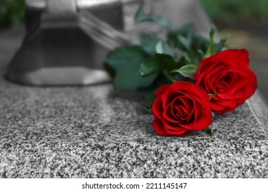 Red Roses On Grey Granite Tombstone Outdoors, Space For Text