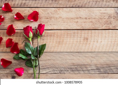 Red roses on wooden background with copy space - Powered by Shutterstock