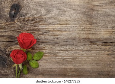 Red roses on wooden table. Blank board, copy space - Powered by Shutterstock