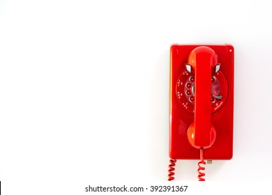 Red Rotary Phone Hanging On Wall